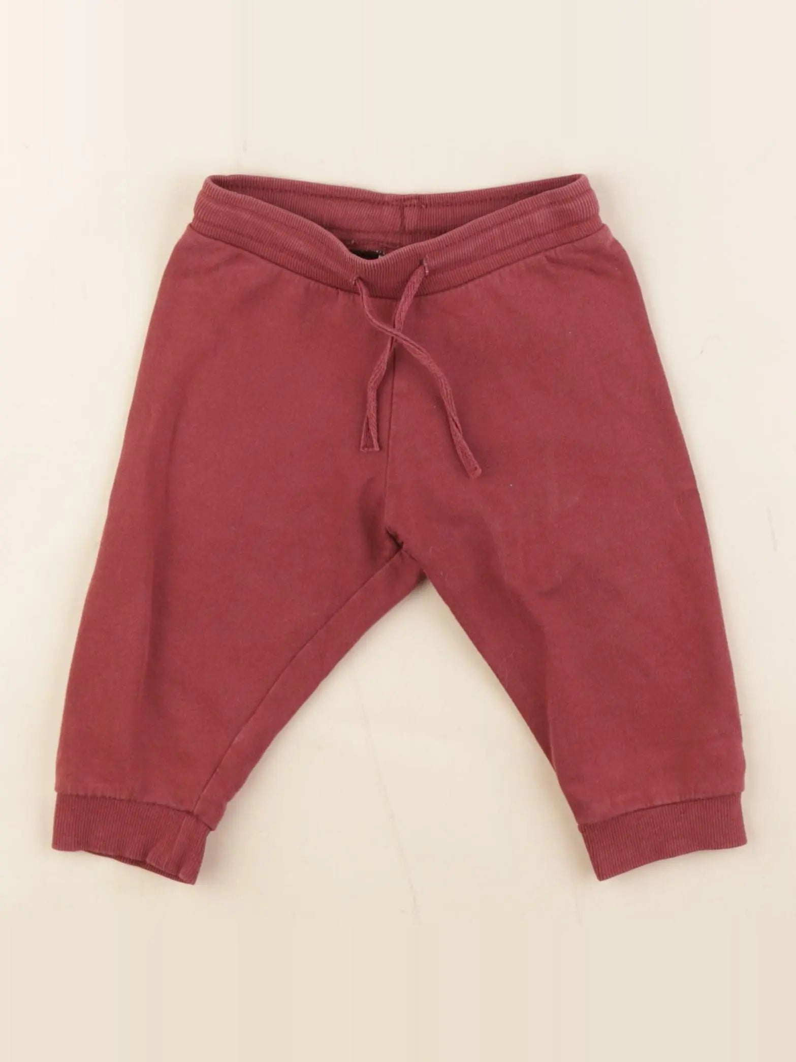 H&M - jogging rouge - 6/9 mois