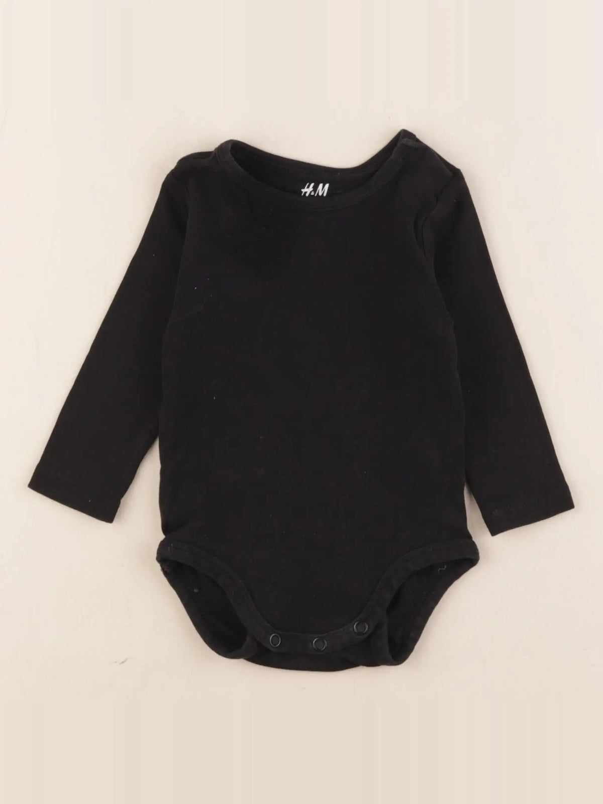 H&M - body noir - 4/6 mois