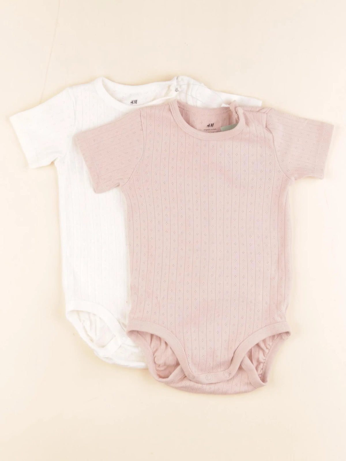 H&M - lot de 2 bodies en coton rose, blanc - 9/12 mois