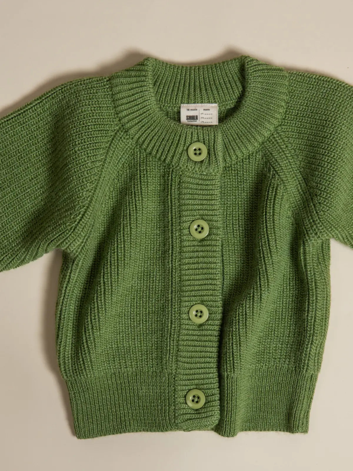Le gilet bébé 100% laine Vert pistache