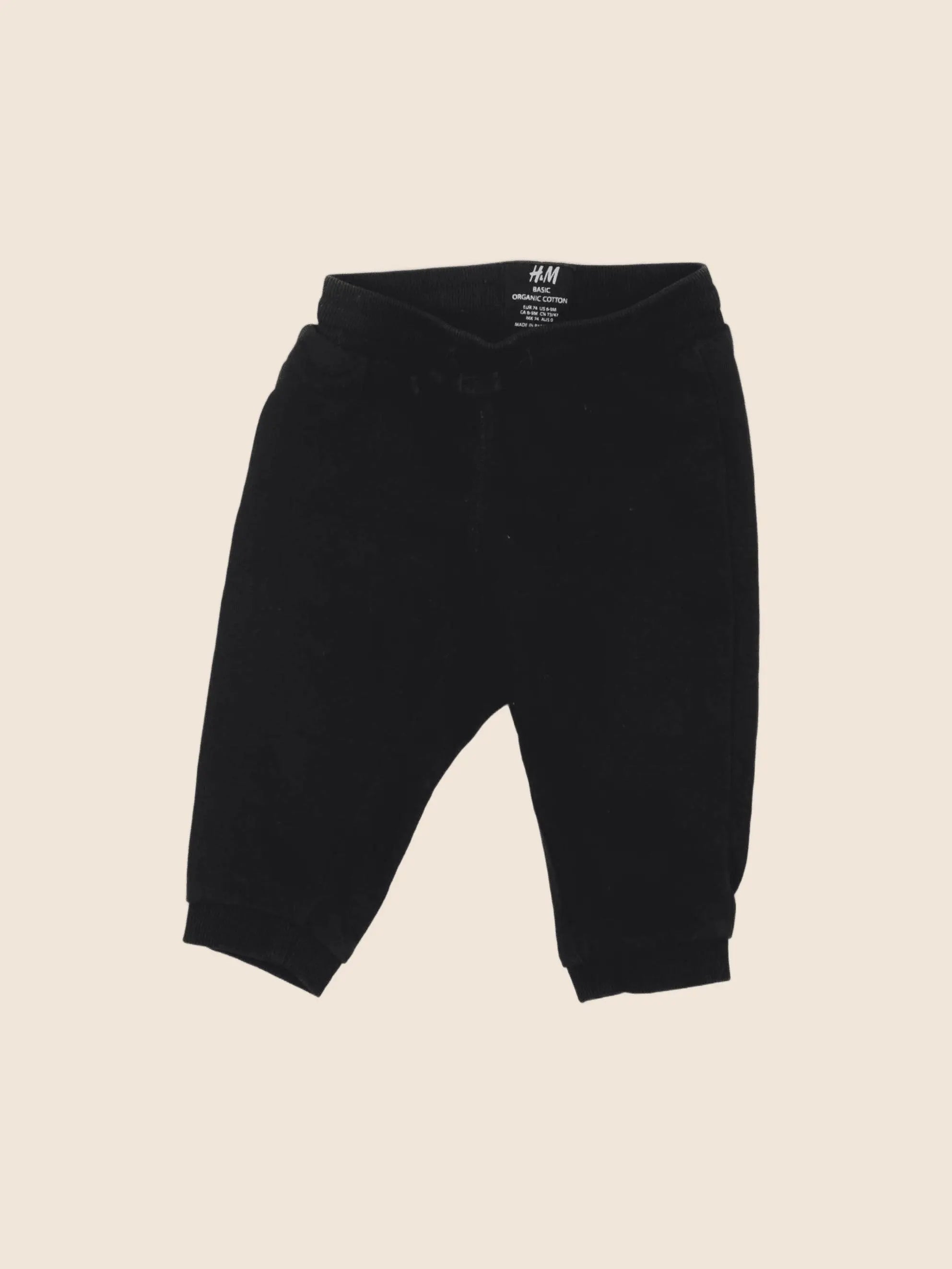 H&M - jogging noir - 6/9 mois