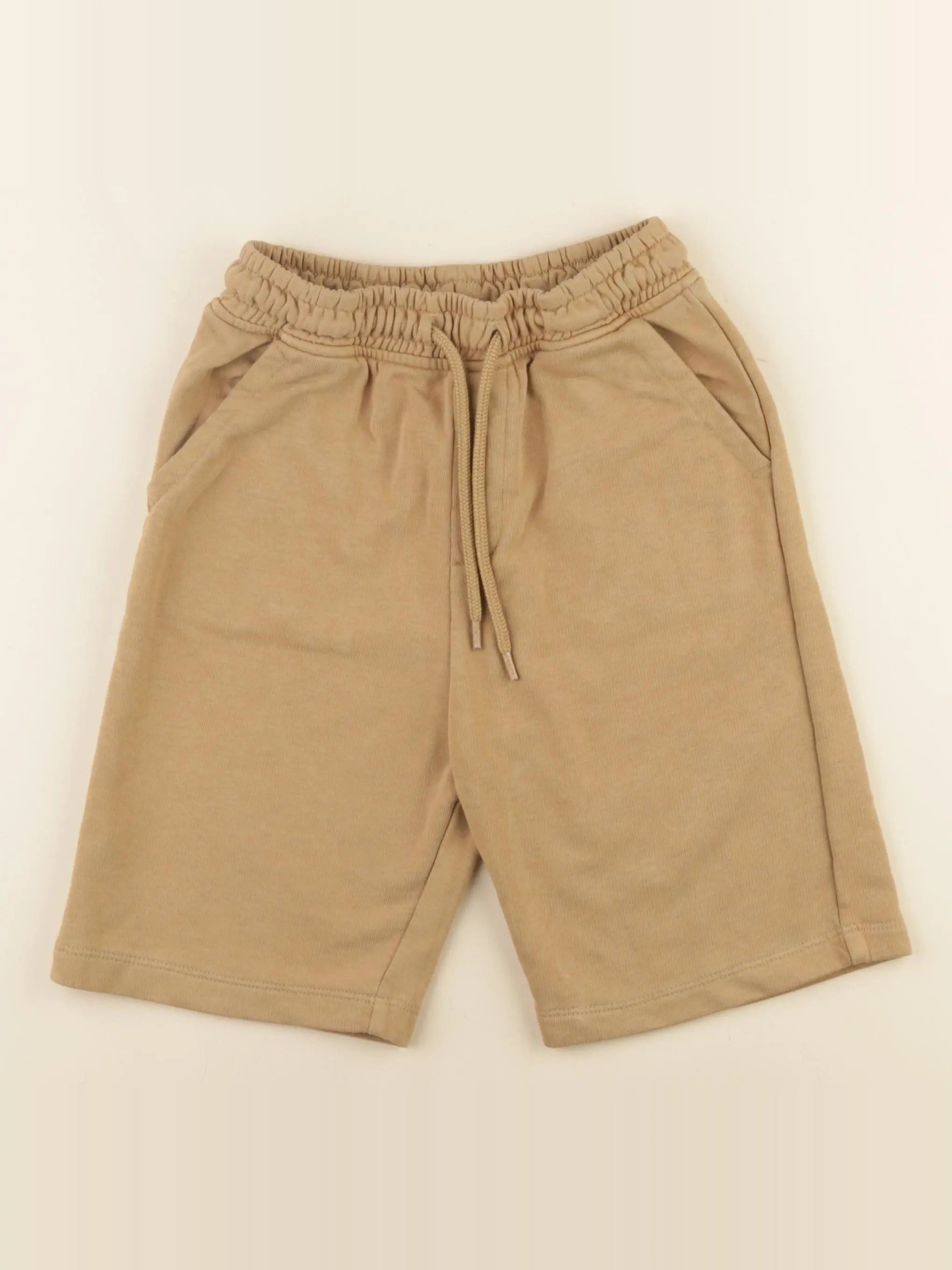 Next - short marron - 9 ans