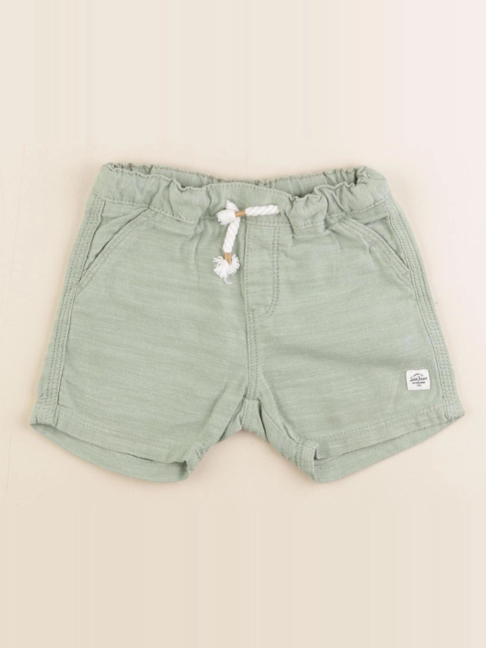 H&M - short vert - 12/18 mois