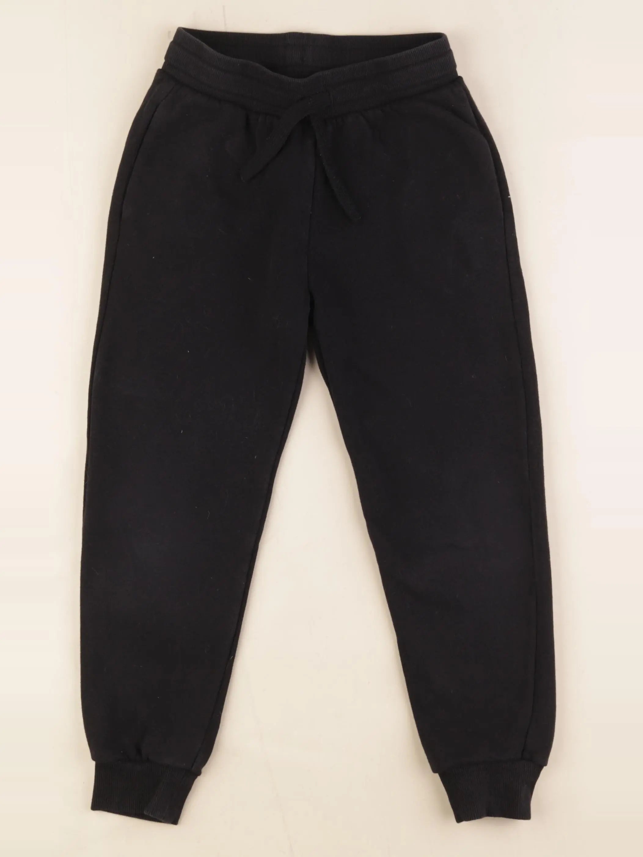 H&M - jogging noir - 6/7 ans