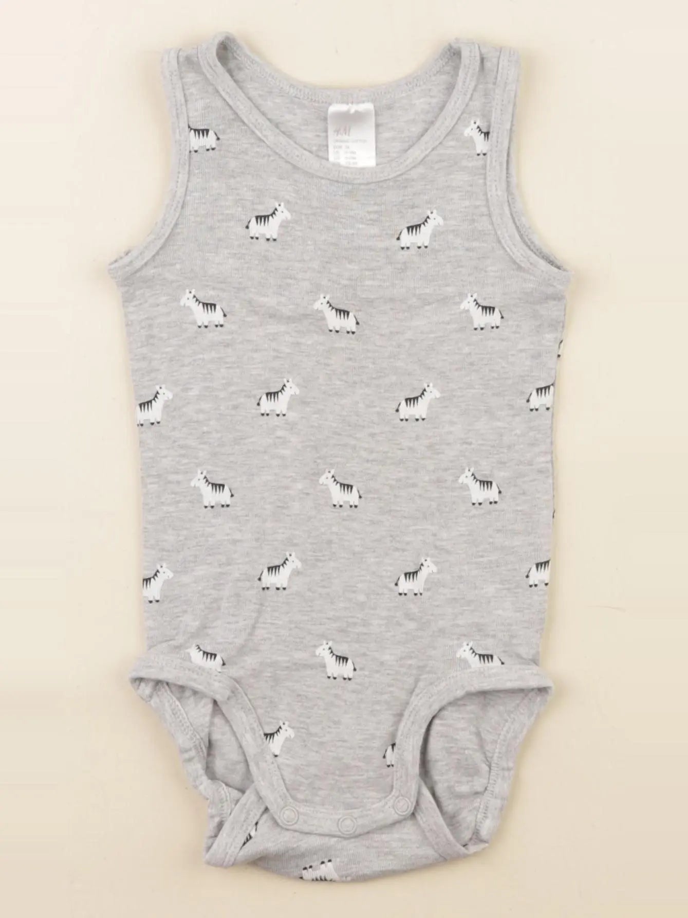 H&M - body gris - 6/9 mois