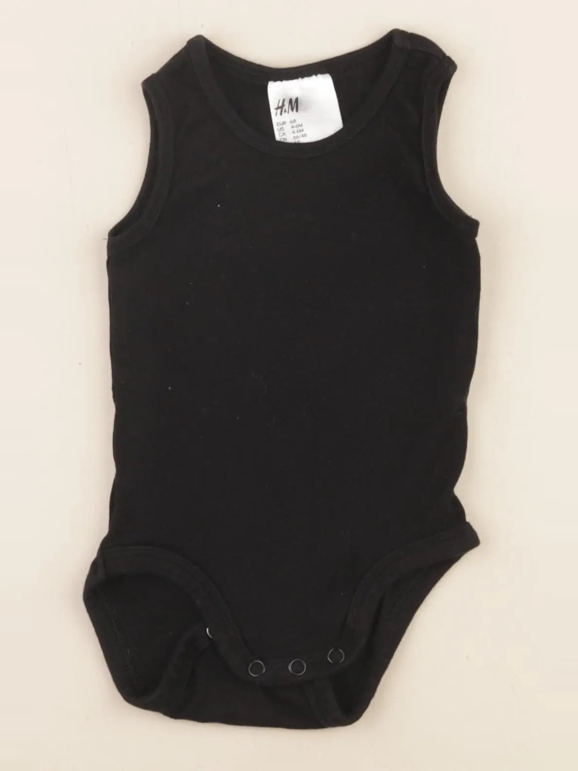 H&M - body noir - 4/6 mois