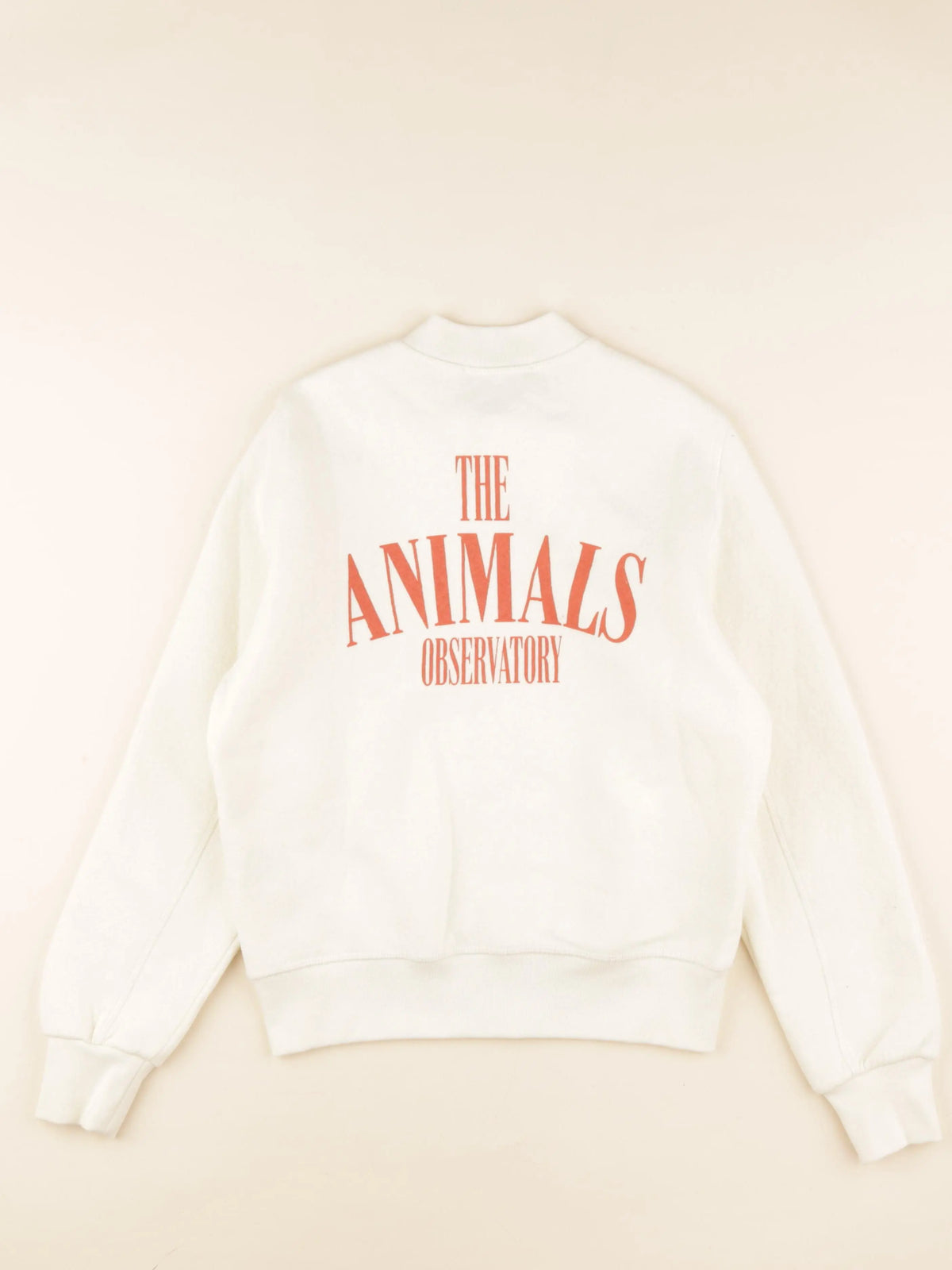 Sweat imprimé au dos beige