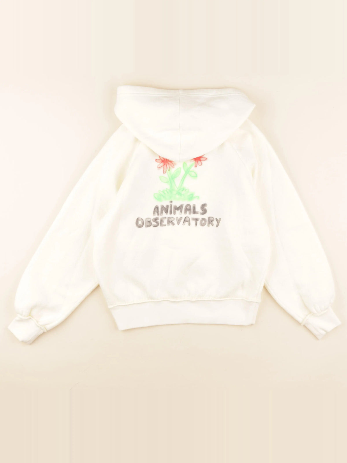Sweat imprimé au dos beige