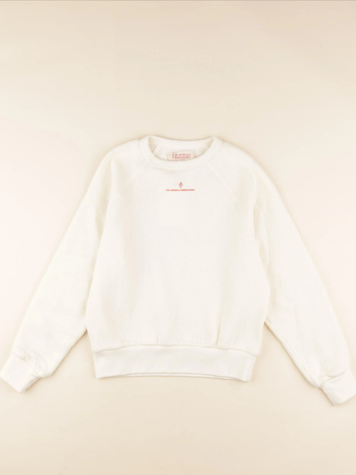Sweat imprimé au dos beige