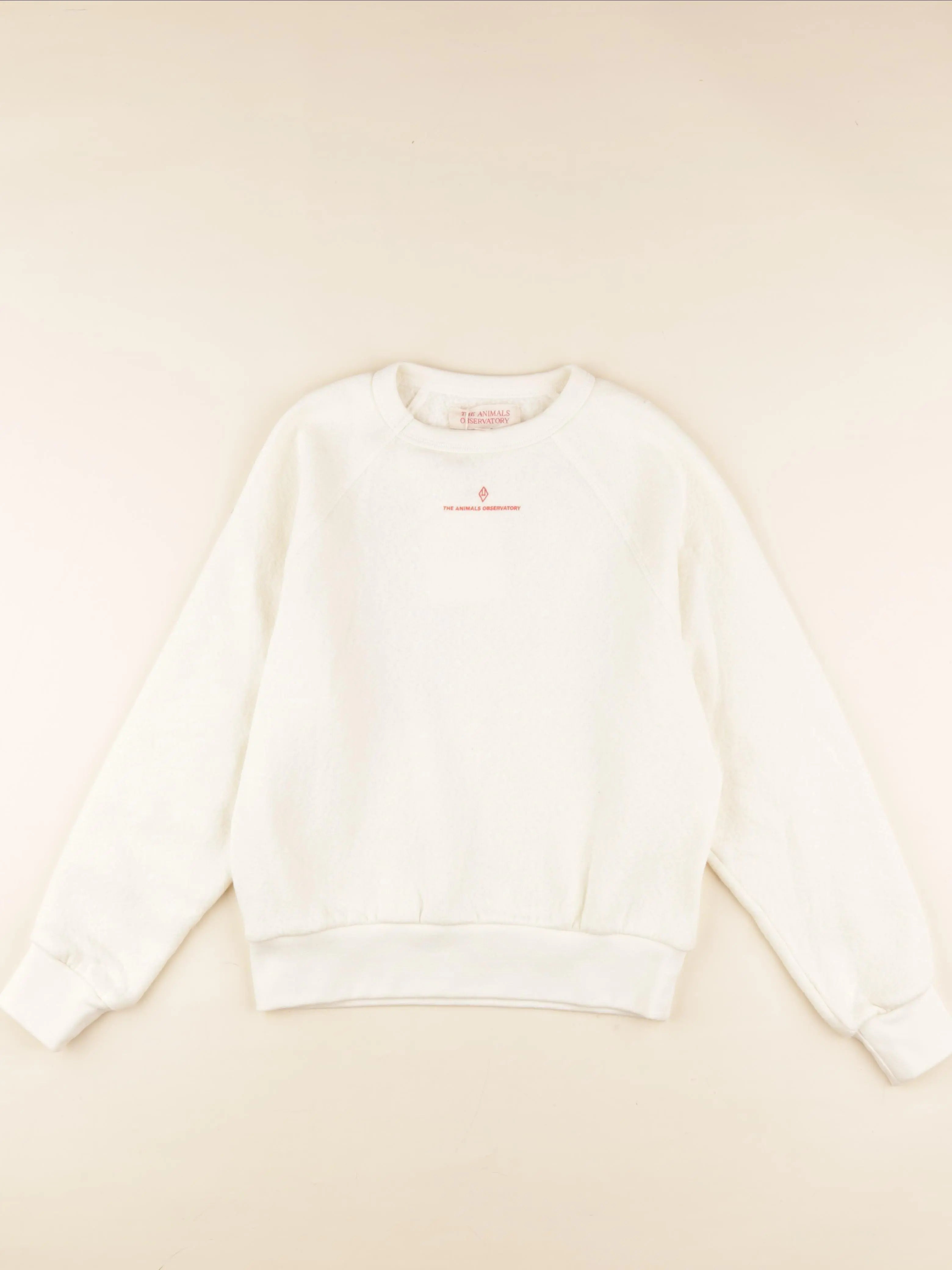 Sweat imprimé au dos beige
