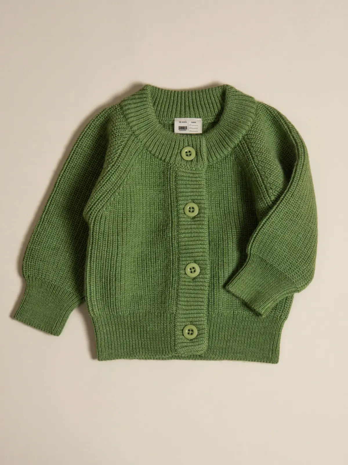 Le gilet bébé 100% laine Vert pistache