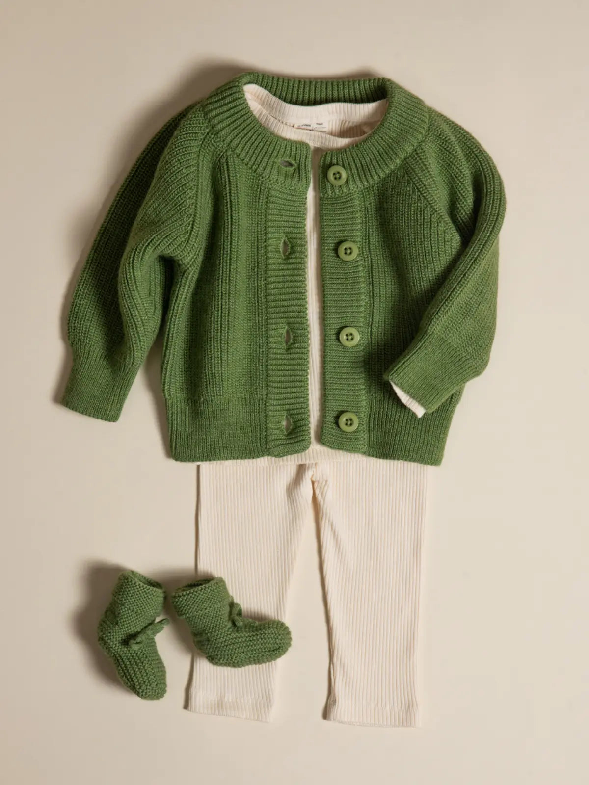 Le gilet bébé 100% laine Vert pistache