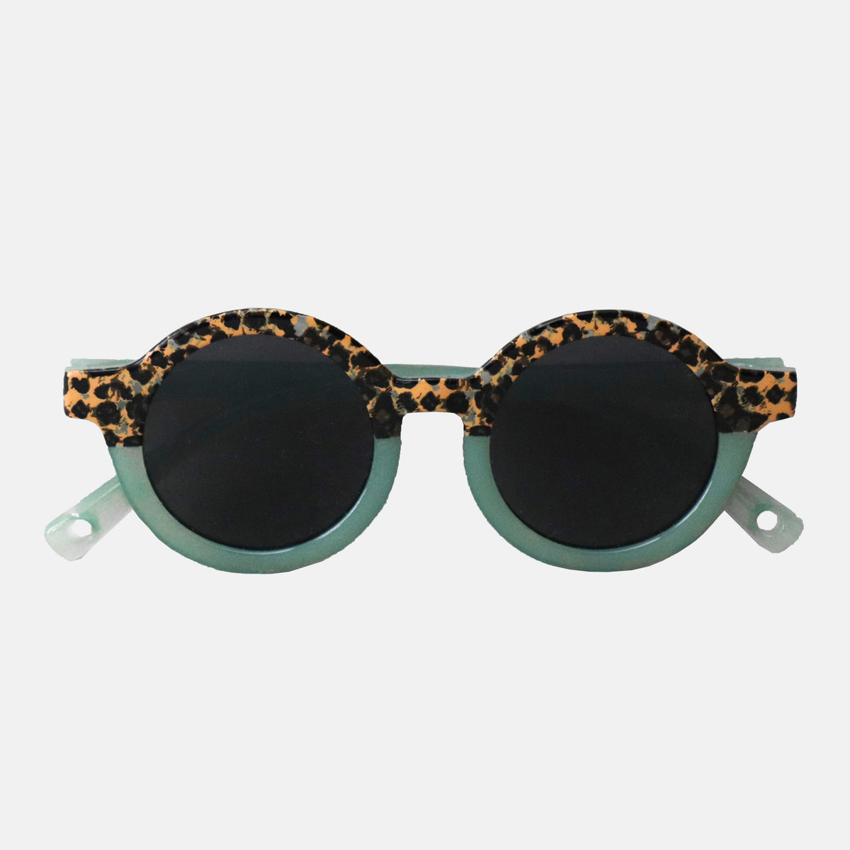 Paire de lunettes de soleil bébé catégorie 4, monture en TPEE effet transparent couleur vert avec motif léopard sur le haut 